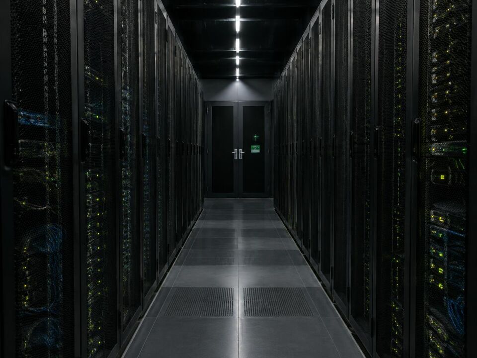 Server racks with green status indicators in a data centre
